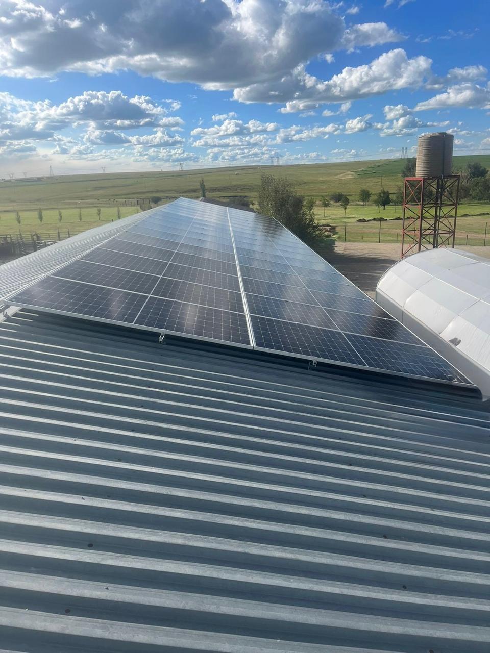 Large rooftop solar array installed on a farm shed