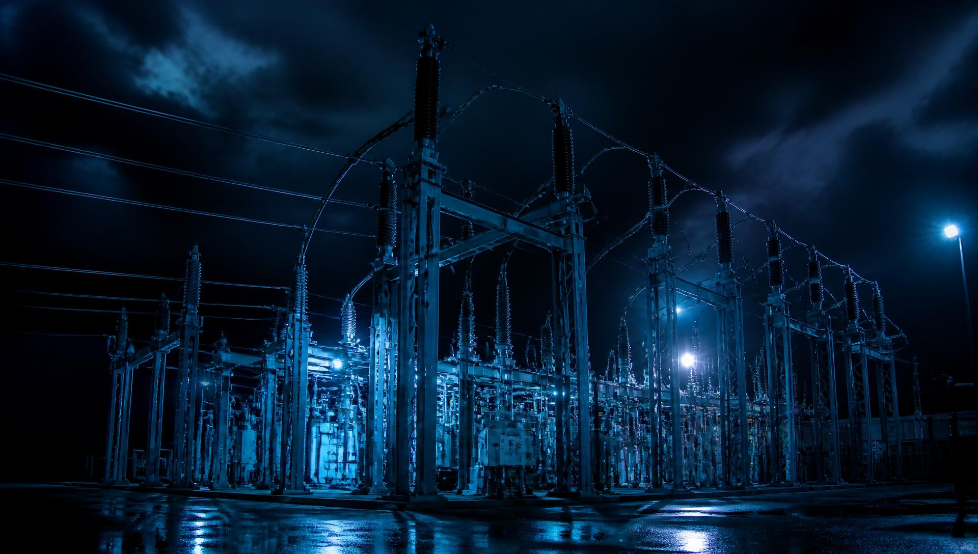 Electrical infrastructure lit by blue lighting at night